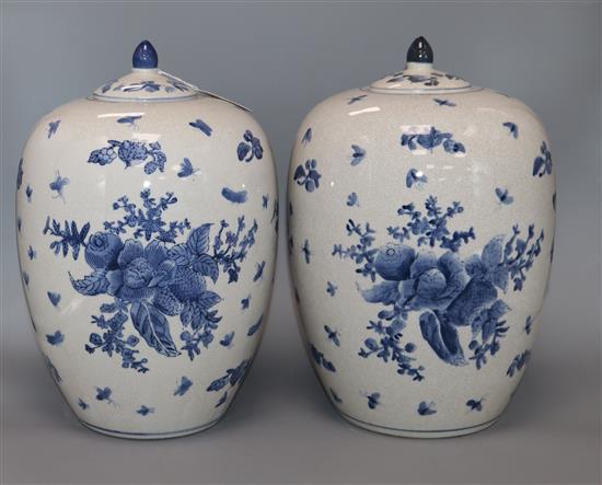 Two lidded blue and white vases height 32cm